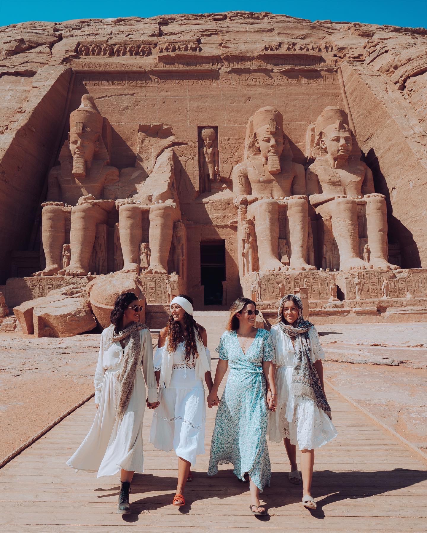 The colossal statues of Ramesses II carved into the rock face at Abu Simbel, Egypt