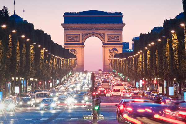 Arc de Triomphe avenue in Paris at dusk